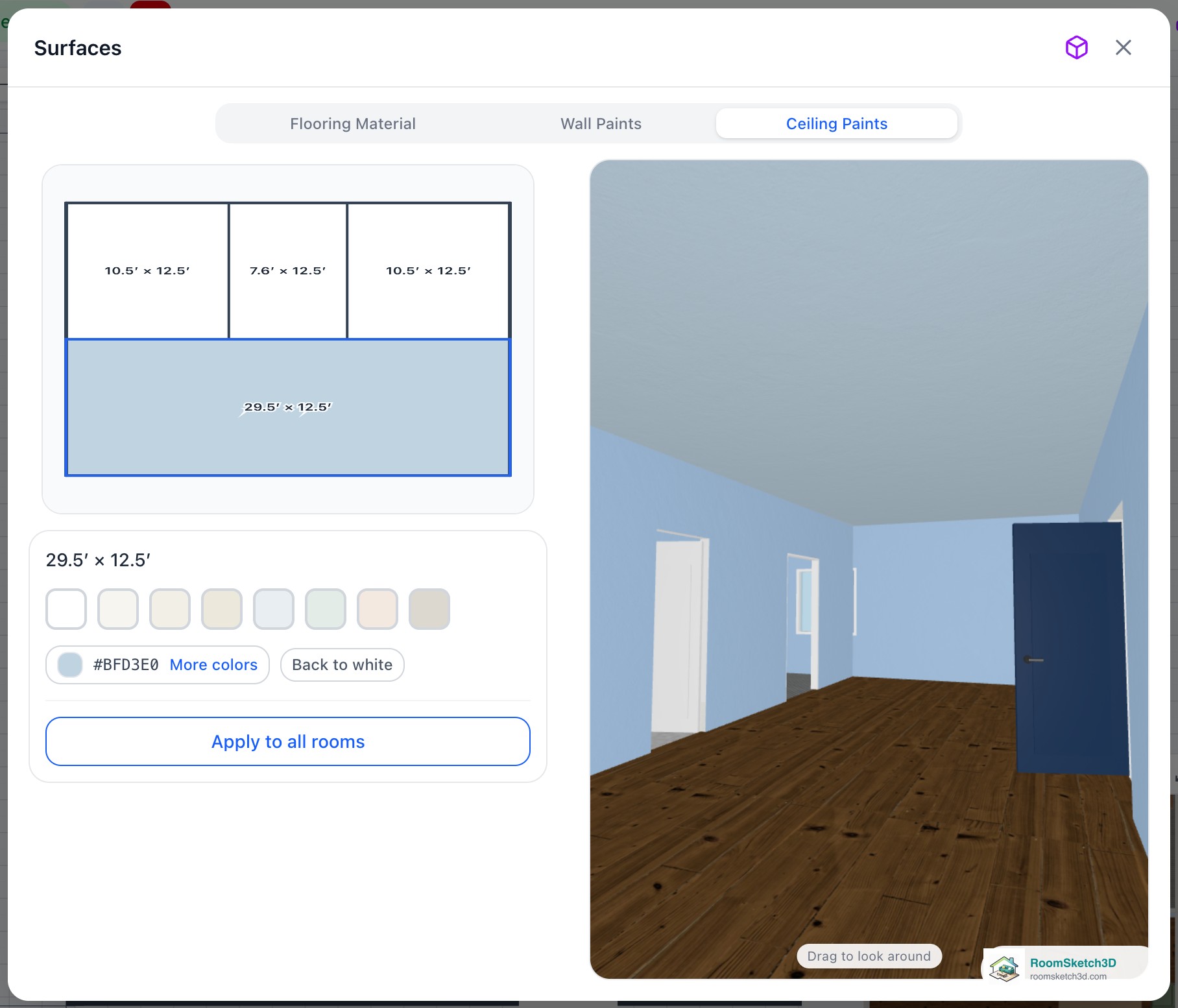 The Ceiling Paints tab with a pale blue picked for the living room: the hex code shows beside More colors, Back to white and Apply to all rooms appear below, and the 3D view shows the blue ceiling over the room — RoomSketch3D floor plan creator