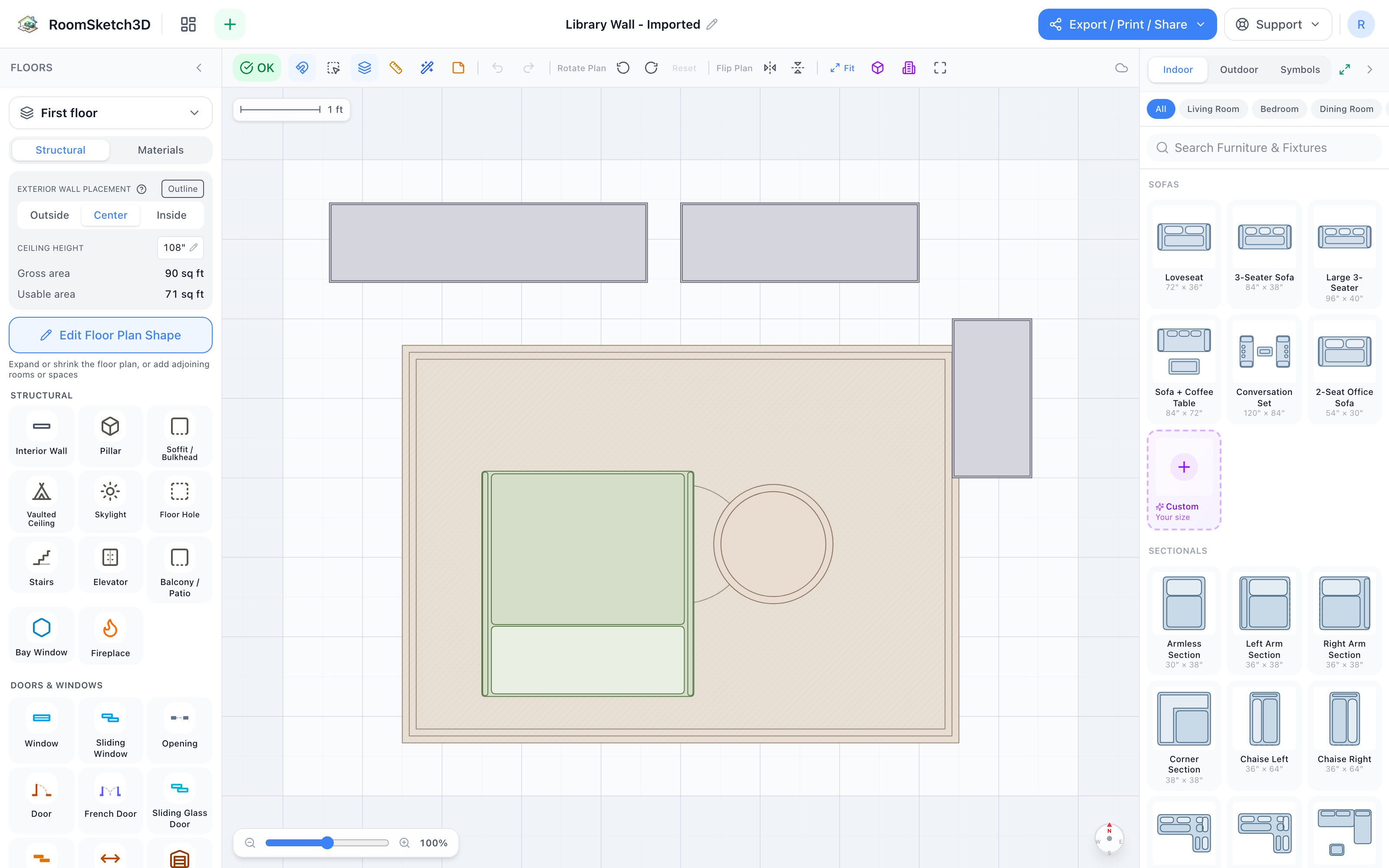 Library wall floor plan in 2D: wide and standard bookshelves in a run along the top wall, tall bookshelf on the right wall closing the corner, reading chair facing the shelves, round end table, all on a sideways 5×7 rug — RoomSketch3D room planner app