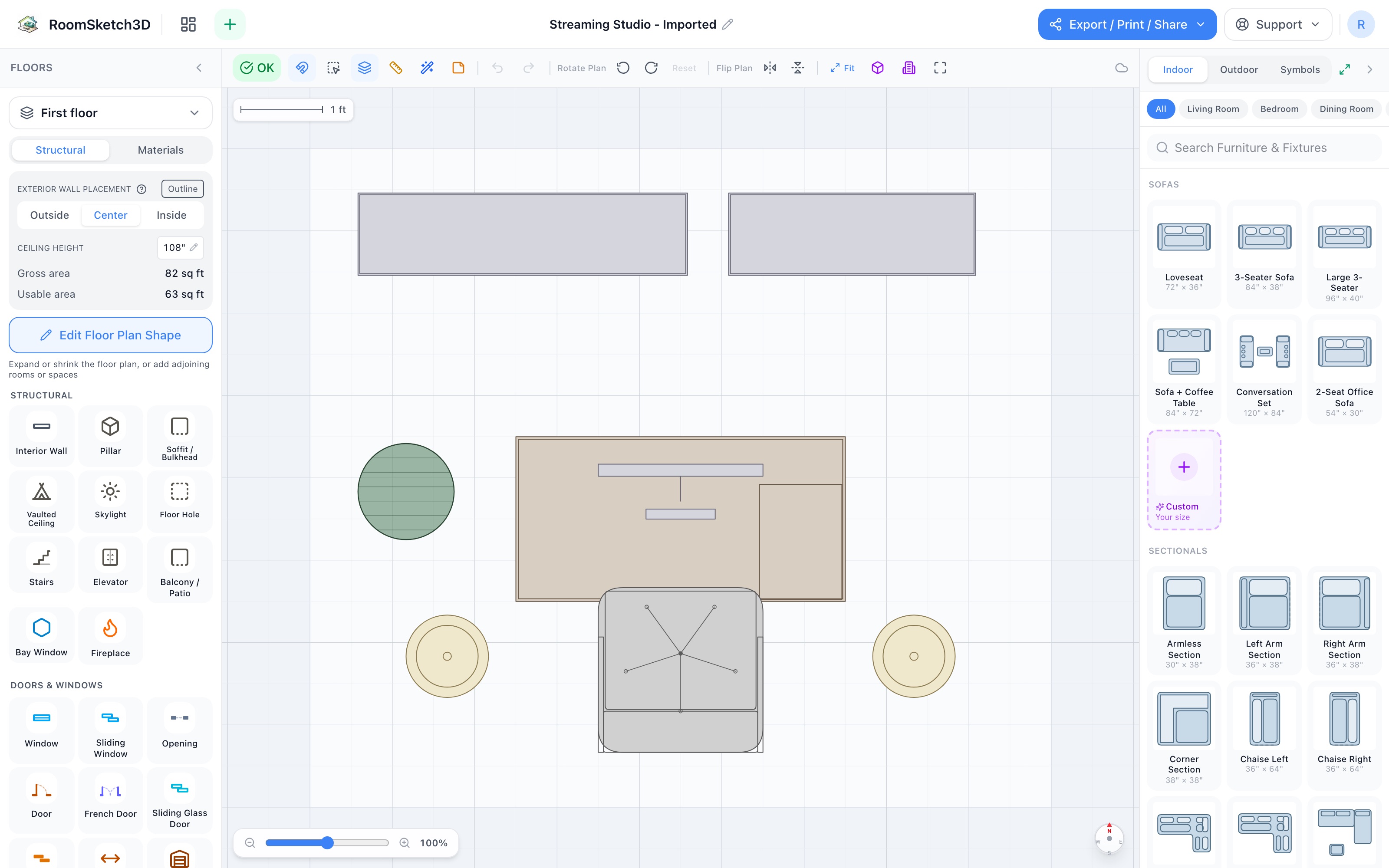Streaming studio floor plan in 2D: two bookshelves side by side along the top wall, a centered desk with a monitor floated off them, an office chair at the desk, two floor lamps flanking the chair, and a small plant at the left edge — RoomSketch3D 3D floorplan software
